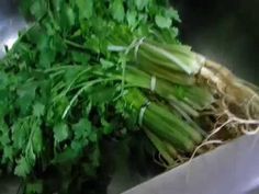 some green vegetables are sitting in a sink