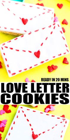 two envelopes with hearts on them and the words love letter cookies written in black