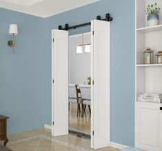 an empty room with blue walls and white doors