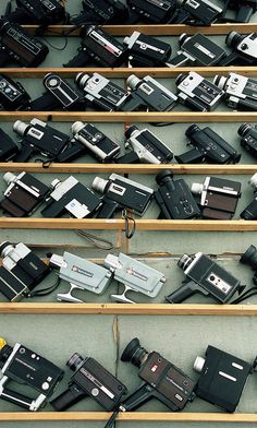 many different types of electronic devices on display in a room with no people around them