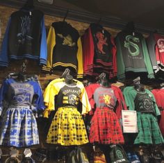 many shirts and skirts are on display in a store