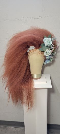 This wig made of synthetic material. It comes with a lace front and baby hairs. The flowers are made of silk. This wig can be made in many colors. Contact me for options. I take a lot of time creating these wigs and the last thing I want is for it to arrive a mess. I take extra care when packing and shipping your wig. Your wig will be shipped on a styrofoam head. I place those heads in the center of the box and use wire to secure it to the bottom. This keeps the head from being able to move around in the box and your wig to stay untouched in travel. I include a piece of polyester fabric, I recommend storing your wig with this covering it. This will help keep dust from settling on your fabulous wig. There is an option to purchase a canvas wig block and wooden stand that was hand crafted by Styrofoam Head, Baby Hairs, Wig Making, Knoxville Tn, Wooden Stand, Baby Hairstyles, Lace Front, Beauty Book, Polyester Fabric