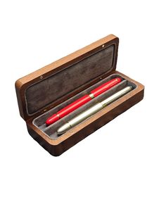 a wooden box with two pens in it and a pen case on the inside that is open