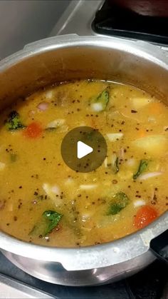 a pot filled with soup sitting on top of a stove