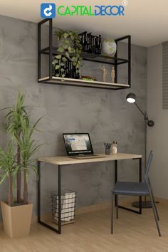 a computer desk with a laptop on top of it next to a potted plant