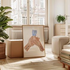 a living room with a plant and pictures on the wall