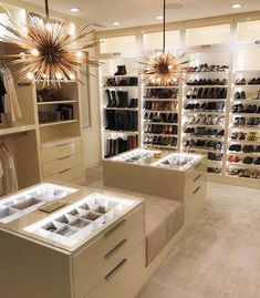 a large walk in closet filled with lots of shoes