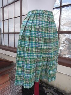 "Vintage 50's-60's perfect wool plaid pleated skirt. Main colors, are cream, teal and green. Great condition; no notable flaws. Hidden zip with button closure. Unlined. Waist:12.25\" across (24.5\" waist, a 25\" waist would be snug but it has a tiny bit of give) Length:21.25\" Hips:open (pleated)" Retro Green A-line Skirt, Retro Blue Pleated Skirt, Retro Green Pleated Skirt, Vintage Blue Full Skirt, Retro Blue Full Skirt, Vintage Blue Pleated Skirt Bottoms, Vintage Blue Pleated Skirt, Fitted Vintage Blue Skirt, Retro Green Knee-length Skirt