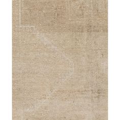 a beige rug with an abstract design on it