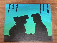 the silhouettes of two people are facing each other on a green and blue background