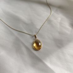 This stunning Pendant is set in 14k Solid Yellow Gold with Natural Citrine with utmost precision. It is a unique gemstone Pendant for nearly every occasion and is completely hassle-free jewelry. ITEM DETAILS: * GEM: Citrine * GEM SIZE: 12X16mm * GEM SHAPE: Oval * Gem Weight: 8.75 carats * Gold Purity: 14KT * Gold Weight: 0.60 gram * Total Weight of the Pendant: 2.35 gram The Gold purity is guaranteed and it comes with authentic 14KT gold hallmark. Since my items are handmade, they are absolutely nickel and lead free. CUSTOMIZATION: * Gemstone customization is available and it can be substituted with a gem of your choice. Kindly message me for the same. PACKAGING * The Pendant comes with layers of safe and secure wrapping along with Free handmade jewelry box with every purchase. ➡️Head to t Yellow Gem Necklace, Topaz Jewelry Yellow, Yellow Jewelry Aesthetic, Gem Stone Jewelry, Sunny Disposition, Yellow Gems, Yellow Hues, Handmade Jewelry Box, Citrine Jewelry