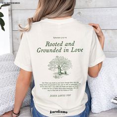 This Unisex jersey short sleeve tee features "Ephesians 3:17-19 | Rooted and Grounded in Love | Jesus Loves You" with a vintage tree illustration on the back and "Jesus Loves You" on the front. Spread God's love and the gospel with this Christian shirt <3 » A B O U T « ‣ This item is made to order using direct-to-garment (DTG) printing technology. This digital process involves the printer inks being jetted or sprayed onto the textile by a print head after the garment goes through a pre-treatment machine to create a stronger bond between garment fibers and the pigmented inks. ‣ This is NOT screen printed NOR do we use heat transfer vinyl (iron-on). ‣ Fabric is manufactured in an eco-friendly process through water reduction, energy reduction and virtually zero waste! » S I Z I N G « ‣ Since Ephesians 3 17, Catholic Shirts, Catholic Shirt, Faith Based Clothing, Love Bible, Church Clothes, Bible Verses About Love, Love T, Vintage Tree