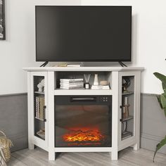 an entertainment center with a fireplace and flat screen tv mounted on it's side