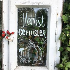 an old window with the words herbs gerlusier written on it in white paint