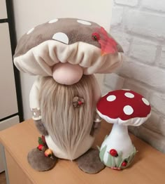 a stuffed mushroom sitting on top of a wooden table