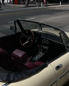 the interior of an old convertible car is shown