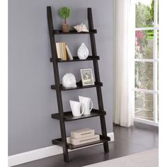 Give your home a fresh new look with this simple ladder bookcase. It's perfect for any bedroom or library space because it can be used both aesthetically, as decorating elements in the room while also holding books on five spacious shelves stacked at an angle which will make them easy to access without having all those messy boxes everywhere! 17 Stories | 17 Stories Wechsler 72" H x 24.75" W Ladder Bookcase 72.0 H x 24.75 W x 16.5 D in black / brown / grayWood | 72" H X 24.75" W X 16.5" D | Wayf Ladder Shelf 3 Ft Wide, Aesthetic Romance, Hanging Ladder, Library Space, Wall Storage Systems, Display Books, Ladder Bookshelf, Books Decor, Versatile Aesthetic