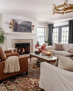 a living room filled with furniture and a fire place