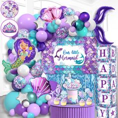 a mermaid themed birthday party with balloons and decorations