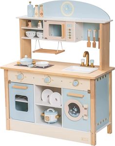 a wooden toy kitchen with blue and white appliances on it's sides, including a sink