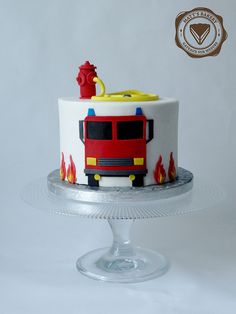 a birthday cake decorated with a fire engine