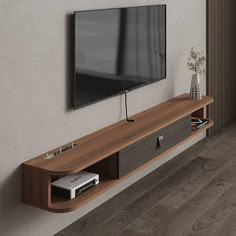 a flat screen tv mounted to the side of a wooden entertainment center in a living room