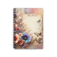 a spiral notebook with flowers and butterflies on it