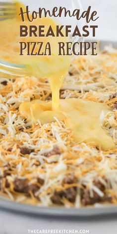 homemade breakfast pizza recipe being drizzled with cheese