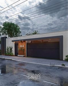 an image of a modern house with garages and plants in the front yard at dusk