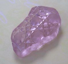 a purple rock sitting on top of a table