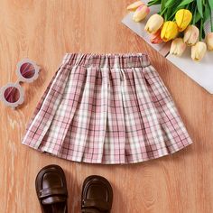 Product Introduction: High-quality, plaid pleated skirt for toddlers with a chic and sophisticated college style - perfect for your little fashionista.
Fabric: Made of 98% polyester and 2% spandex.
Care Instruction: Machine wash in cold water and tumble dry low heat.
Key Features: * Product Features: Plaid pattern, pleated design
* Fabric Characteristics: Soft, comfortable, stretchy
* Piece of Product: One pleated skirt
* Style: Perfect for the chic college fashion style
* Fit: True to size
* Length: Knee-length
* Source of Goods: Made in China
* Supplier: PatPat
Additional Information: Suitable seasons: All seasons
Suitable occasions: Perfect for school, family outings, and other special occasions
Product design: Chic, college style with a plaid pattern and pleated design. Pleated Skirt Style, School Skirt, Plaid Pleated Skirt, Family Outings, College Style, Skirt Style, Design Fabric, Product Introduction, College Fashion