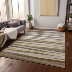 a living room with a couch, chair and rug