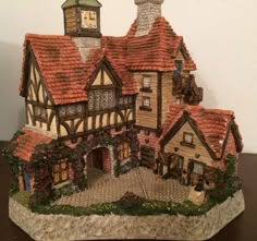 a figurine of a house on a table