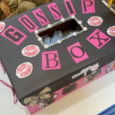 a box that has lipstick on it with the word boss written in pink and black