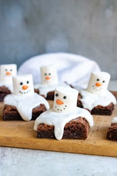 chocolate brownies with marshmallows and frosting in the shape of snowmen