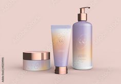 an assortment of skin care products on a pink background