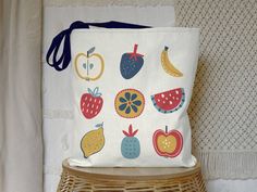 We are currently experiencing significant production delays with our totes due to Hurricane Helene. At this time, we are unable to predict exactly how long production will take, but are estimating 2-4 weeks. Say goodbye to single-use plastic with this Colorful Fruit Reusable Tote Bag - a delightful and eco-friendly shopping companion! This vibrant bag, adorned with an array of fruits, is perfect for trips to the farmer's market or grocery store. The colorful design adds a touch of fun to your er Organic White Rectangular Bags, White Rectangular Organic Bag, White Organic Rectangular Bags, Organic White Reusable Bag, Cute Farmers Market, Fruit Tote Bag, Grocery Tote, Colorful Fruit, Soft Bristle Brush