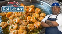 a man standing in front of a plate of shrimp