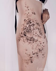 a woman's back with flowers on it