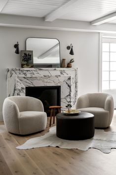 a living room filled with furniture and a fire place