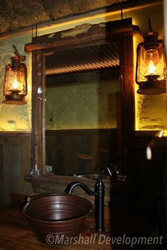 a bathroom with a sink, mirror and lights