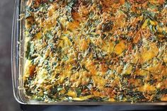 a casserole dish with spinach and cheese