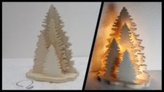 two wooden christmas trees with lights on them