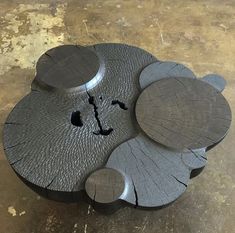 a metal plate with three different designs on it's sides and one is shaped like a flower