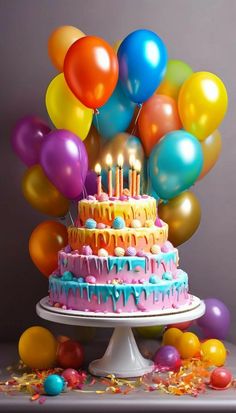 a birthday cake with balloons and confetti on it