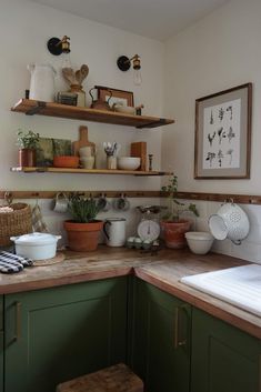 a kitchen counter with pots and pans on it