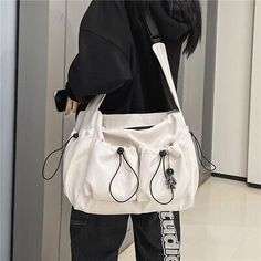 Large Capacity Canvas Shoulder Bag For Streetwear, Streetwear Canvas Bags With Pockets, Urban Everyday White Bag, White Urban Everyday Bag, Everyday Urban White Bag, White Large Capacity Shoulder Bag For Streetwear, Practical Shoulder Bag With Pockets For Streetwear, White Rectangular Shoulder Bag For Streetwear, Modern Bags With Multiple Pockets For Daily Use