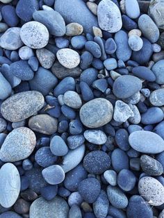 rocks and gravel are arranged together on the ground