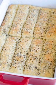 a casserole dish filled with bread and seasoning