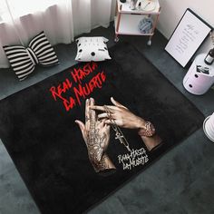 the rug is on the floor in front of a window with tattoos and other accessories